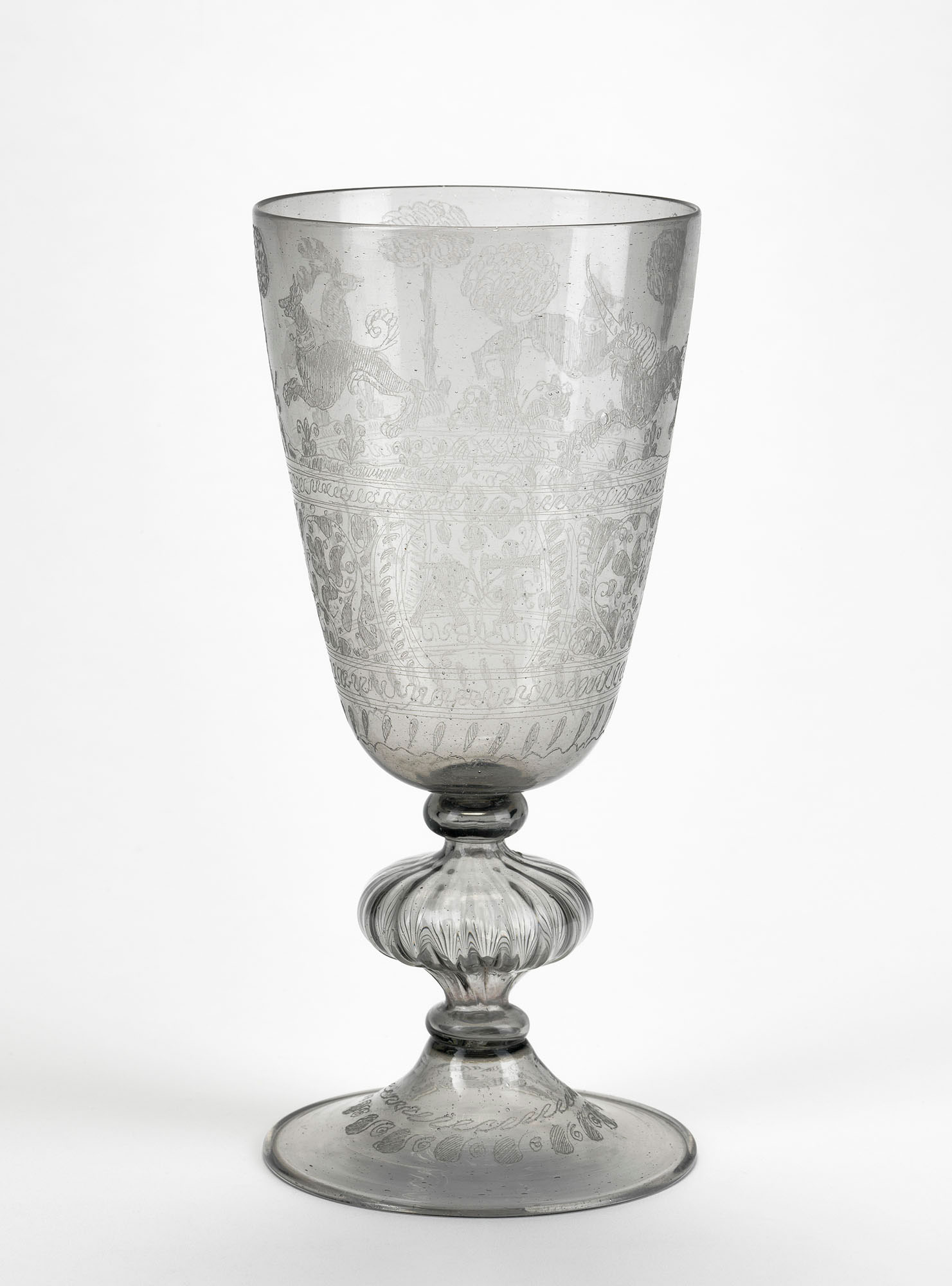Clear glass goblet engraved with a stag, a unicorn, and hounds, and the owners' initials RT and AT entwined by lover's knots