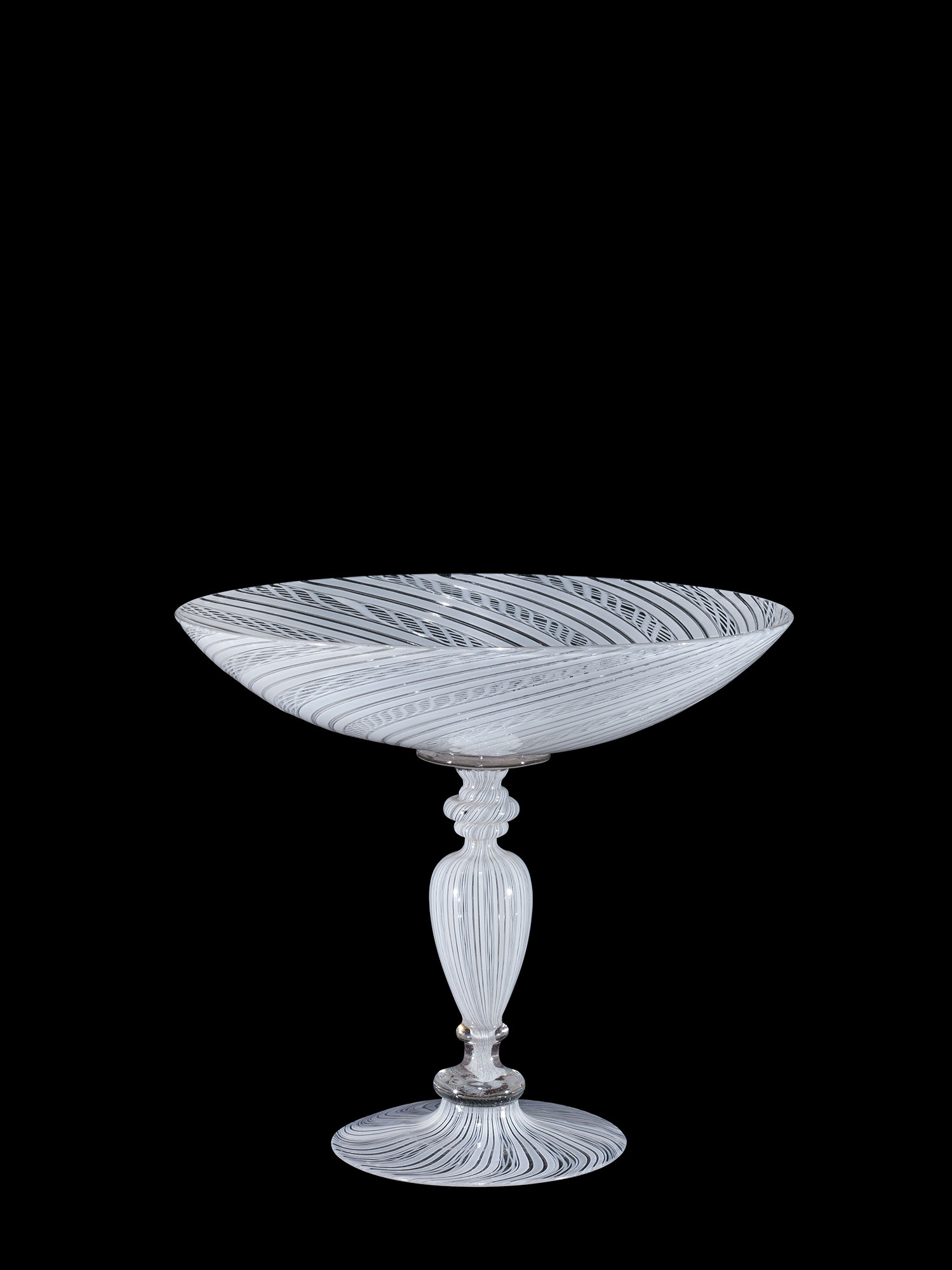 Clear wineglass with grayish, white stripes and a shallow bowl