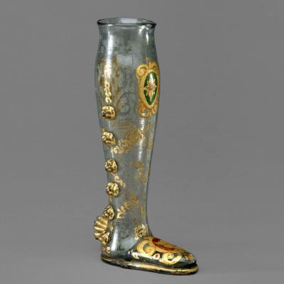 Glass boot-shaped vessel with gold decorations