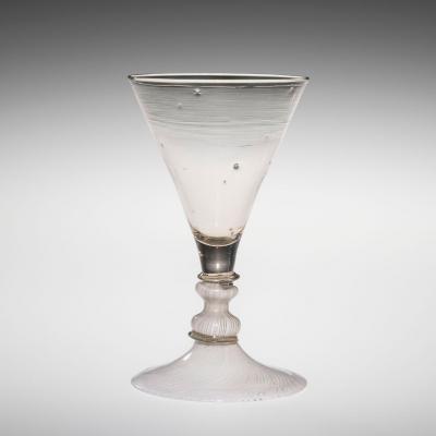 Clear glass goblet with white cane filigrana in the stem and base