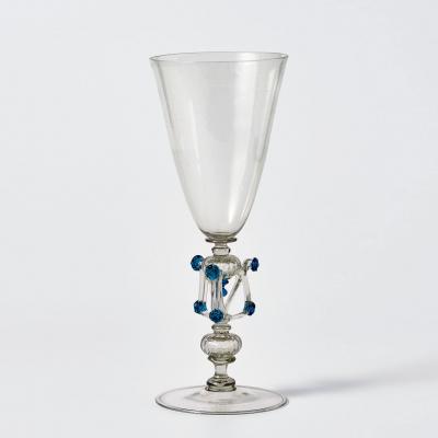 Clear glass goblet with decorative stem featuring a cube shape with blue dots on corners